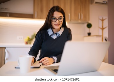Beautiful young woman with glasses is studying and taking notes - Shutterstock ID 1071472691