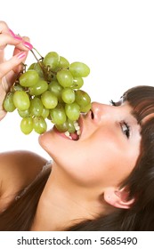 Beautiful young woman with green grape
