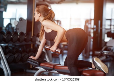 Beautiful Young Woman In Gym Doing Excersise