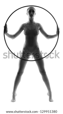 Beautiful young woman gymnast with hula hoop