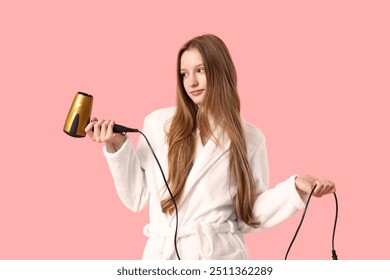 Beautiful young woman with hair dryer on pink background - Powered by Shutterstock