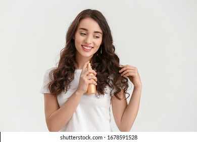 Beautiful Young Woman With Hair Spray On White Background