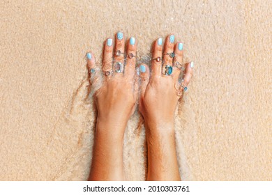 Beautiful Young Woman Hand With Many Rings At Sea Shore Background Close Up 