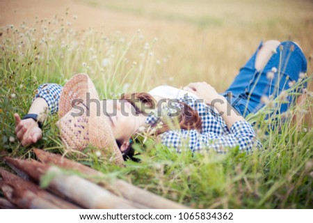 Similar – Foto Bild Junge Frau ruht auf einem Weizenfeld.