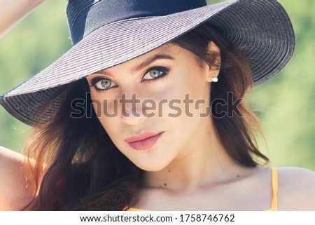 Similar – Young redhead woman covering from sun