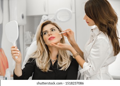 Beautiful Young Woman Having Aesthetic Treatment In Medical Office, Corrective Medicine Concept. Doctor Beautician.