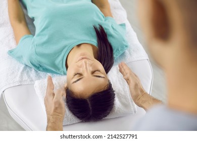 Beautiful Young Woman Having Therapy Session With Professional Reiki Healer. Holistic Treatment, Spiritual Therapy, Energy Flows, Reiki Healing, Relaxation Concepts