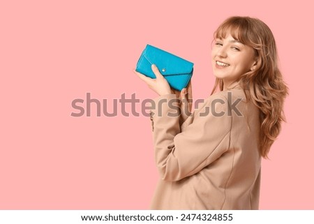 Similar – Image, Stock Photo Woman holding colorful wallets against yellow background