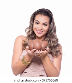 Beautiful Young Woman Holding A Chocolate Egg