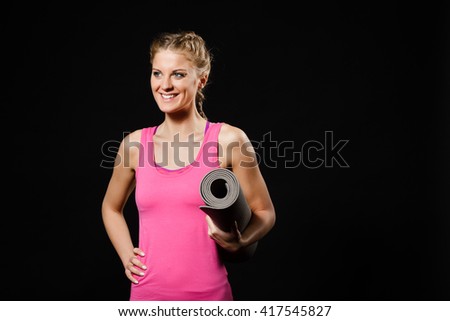 Similar – Close up front upper body portrait of one middle age athletic woman in sportswear in gym over dark background, looking at camera and smiling