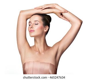 Beautiful Young Woman Holding Her Arms Up And Showing Clean Underarms. Armpit's Care. Armpit Epilation, Hair Removal, Perfect Skin.