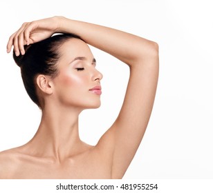 Beautiful Young Woman Holding Her Arms Up And Showing Clean Underarms. Armpit's Care. Armpit Epilation, Hair Removal, Perfect Skin.