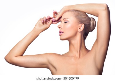 Beautiful young woman holding her arms up and showing clean underarms. Armpit's care. Armpit epilation, hair removal, perfect skin.