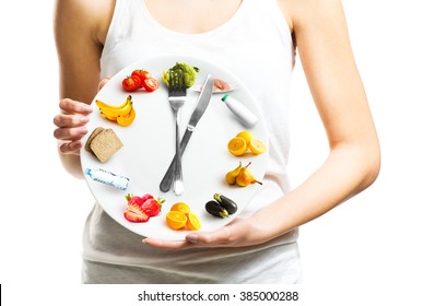 Beautiful Young Woman Holding A Plate With Food, Diet And Time Concept Close Up 