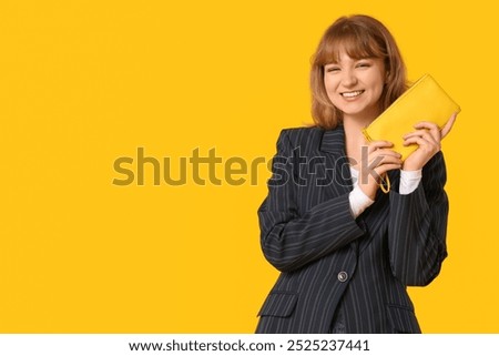 Similar – Image, Stock Photo Woman holding colorful wallets against yellow background