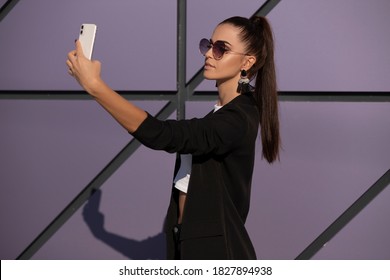 Beautiful Young Woman Influencer Isolated On Violet Wall