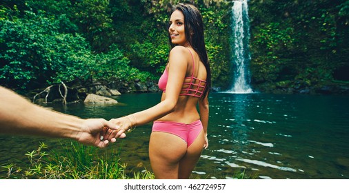 Beautiful Young Woman Leading Man To Waterfall, POV Perspective View