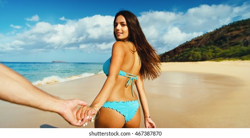 Beautiful Young Woman Leading Man Down The Beach, POV Perspective View