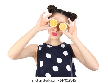 Beautiful young woman with lemon halves near eyes on white background - Powered by Shutterstock