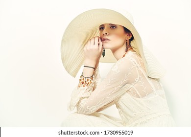 Beautiful Young Woman In Light Elegant Lace Dress And A Wide Brim Hat. Fashion Shot, Summer Style. Copy Space.