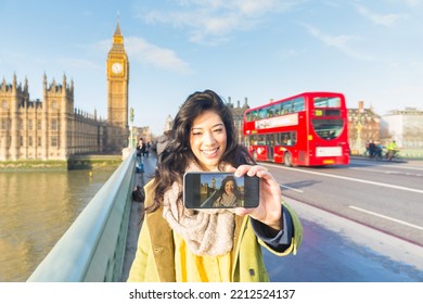 Beautiful Young Woman In London Taking A Selfie With Big Ben And Red Double Decker Bus On Background - Travel And Lifestyle Concepts