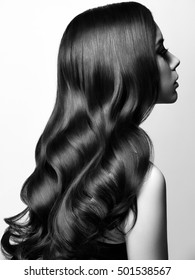 Beautiful Young Woman with Long Healthy and Shiny Smooth Hair. Healthcare and beauty concept