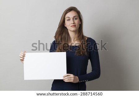 beautiful young woman looking calm holding a blank banner for searching for a job