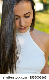 Beautiful Young Woman Looking At Cell Phone In Public Square