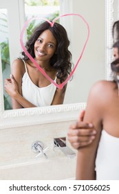 Beautiful Young Woman Looking In Mirror With Heart On It