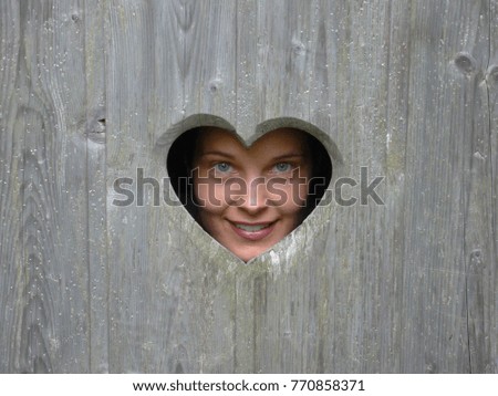 Similar – a curious neighbour looks over a garden fence