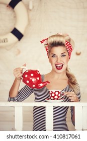 Beautiful Young Woman Making Her Morning Tea In The Kitchen