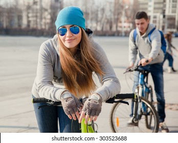 beautiful young  woman and young man with bike in the city - Powered by Shutterstock