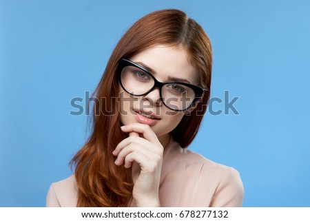 Beautiful young woman on a blue background, portrait.