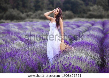 Similar – Woman posing in flower field with a handkerchief