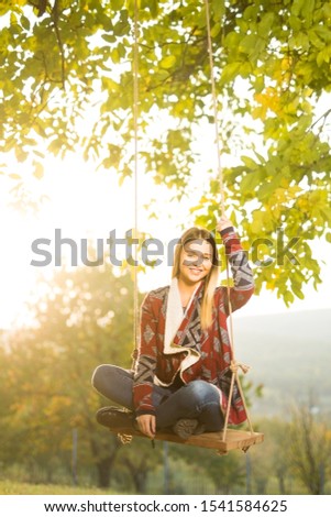 Similar – Happy young woman looking back through the window car