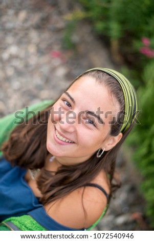 Portrait of a beautiful young woman outdoor smiling