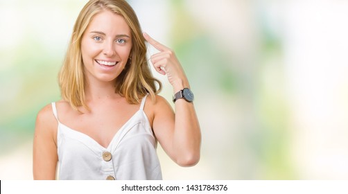 Beautiful Young Woman Over Isolated Background Smiling Pointing To Head With One Finger, Great Idea Or Thought, Good Memory