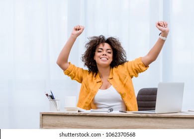 Beautiful Young Woman Performing Victory Dance At Workplace