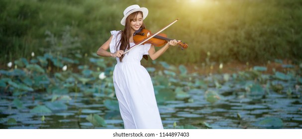  Beautiful Young Woman Playing Violin Outside Nature.