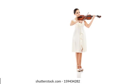 Beautiful young woman playing violin over white background