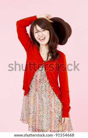 Similar – Young cheerful woman with a gift over her head