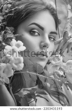 Similar – Portrait of woman in with red flower