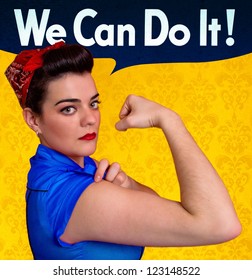 Beautiful young woman posing as working girl and representing the ideals of the original poster of Rosie the Riveter, year 1943