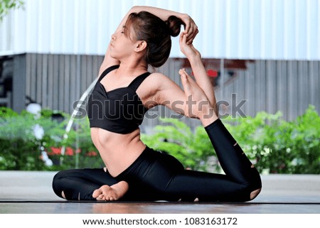 Beautiful young woman practicing yoga 