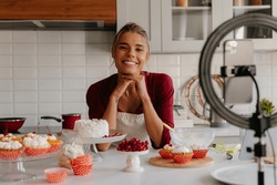 Beautiful Young Woman Preparing Cream For Homemade Cake And Recording Video For Food Blog