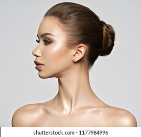 Beautiful young woman - profile view. Beauty treatment concept. Portrait of a pretty  caucasian girl with healthy skin.