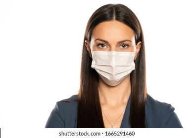 Beautiful Young Woman With Protective Mask On Her Face On White Background