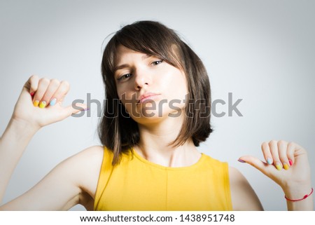 beautiful young woman proud of herself isolated on background