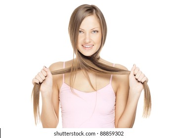 beautiful young woman pulls her long hair