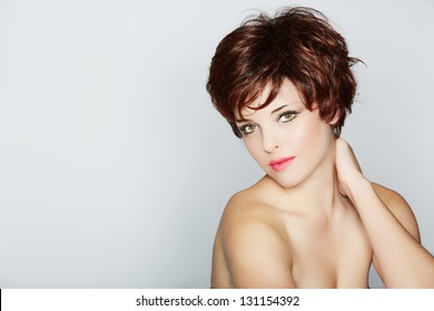 Beautiful Young Woman With Red Hair Wearing Short Pixie Crop Hairstyle On Studio Background